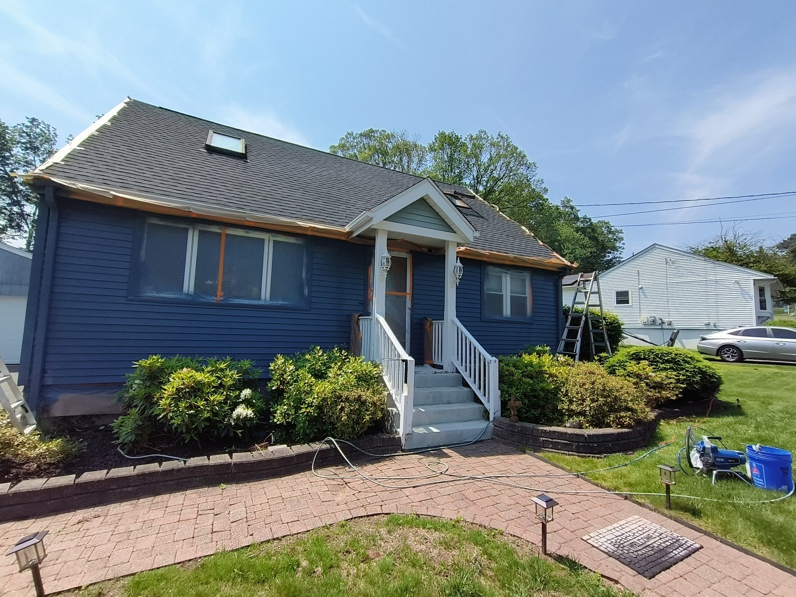 Exterior House Siding Painting Dark Blue Masked Windows — Frank Leonard Painting LLC