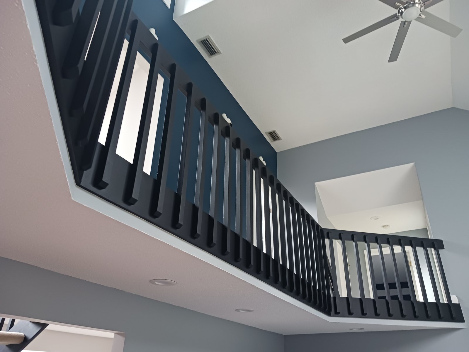 Interior Mezzanine Black Railings Blue Gray Walls White Ceiling — Frank Leonard Painting LLC