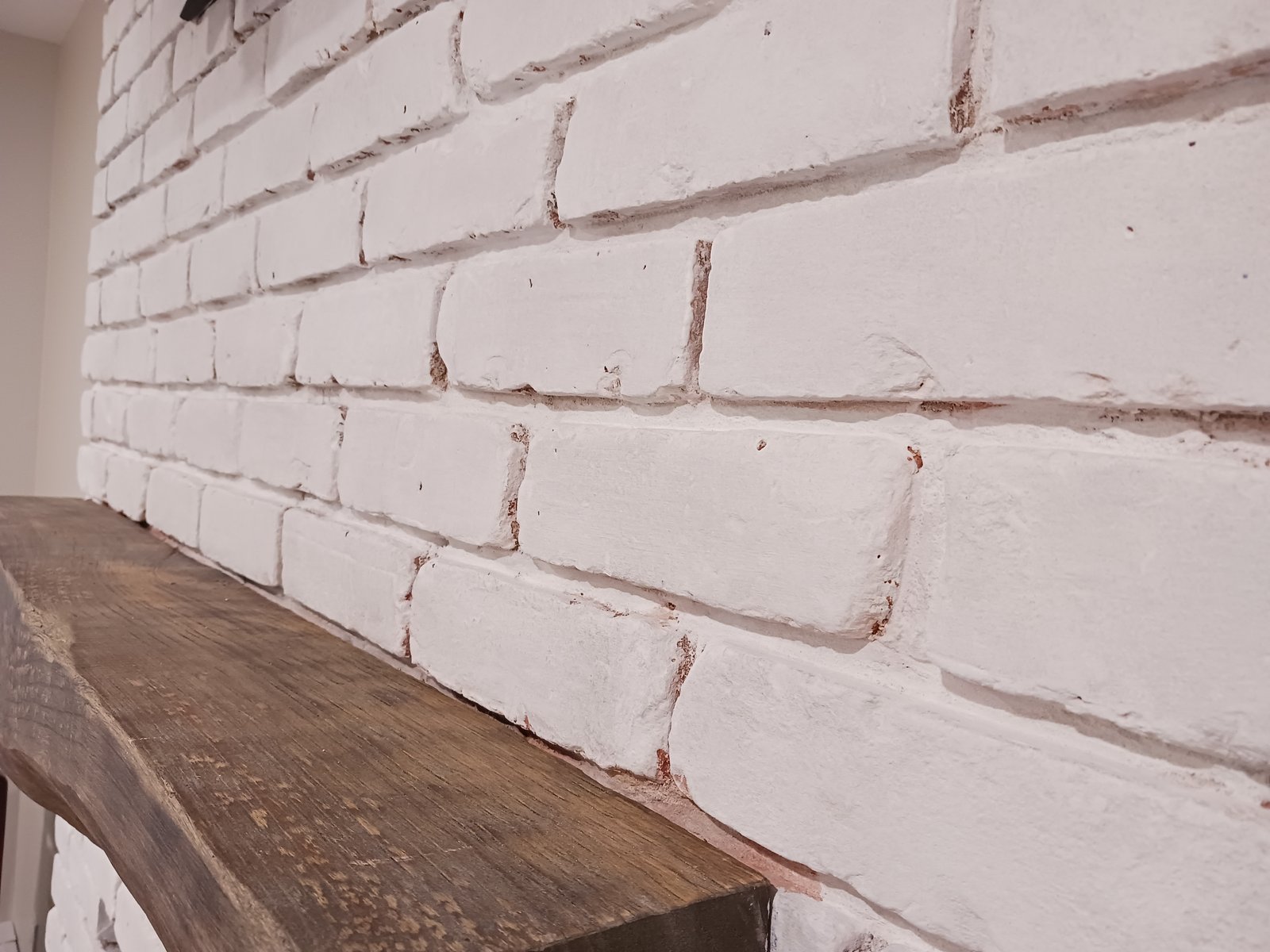Whitewashed Brick Wall Wooden Mantel — Frank Leonard Painting LLC